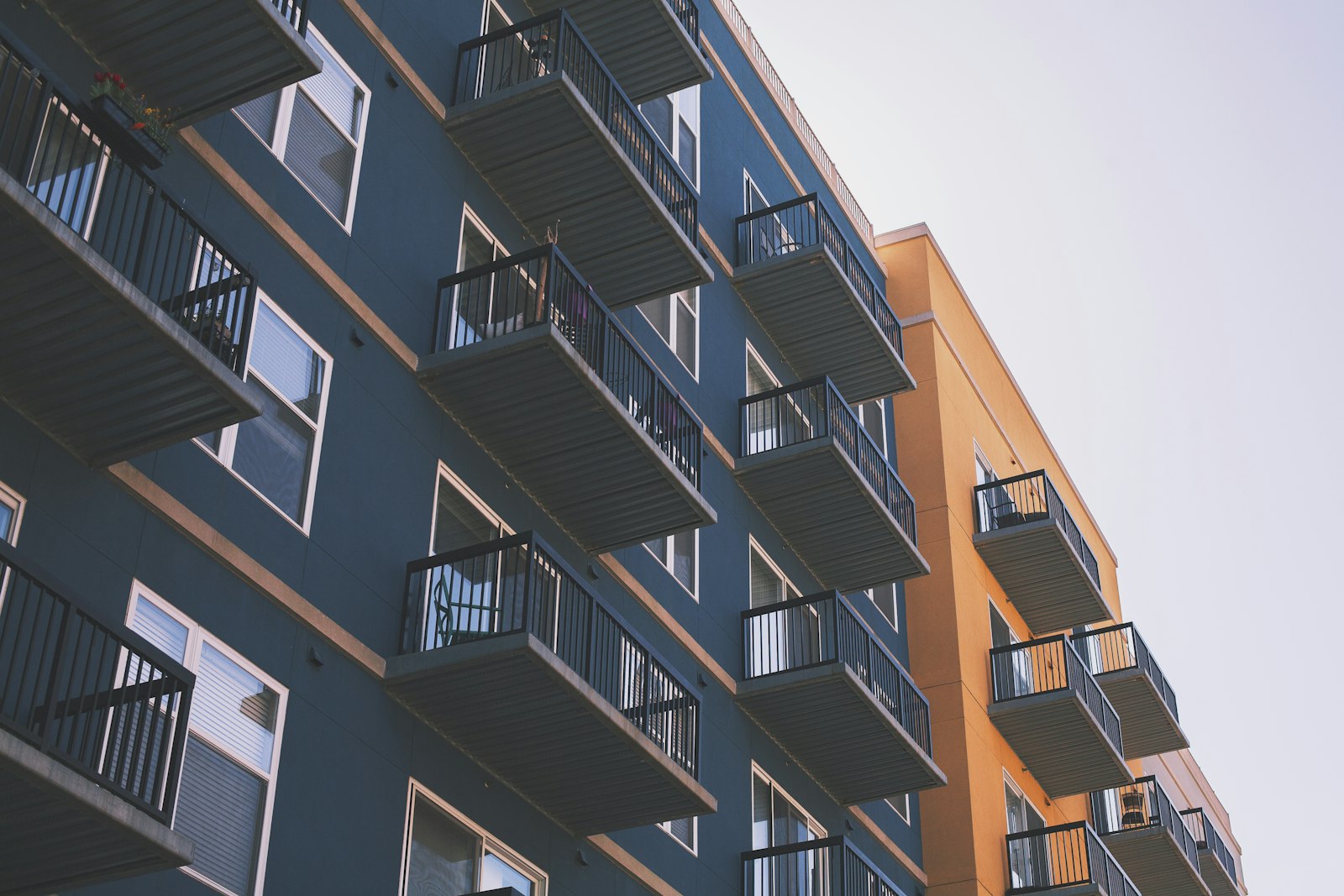 Residential facade with balcony and cladding panels